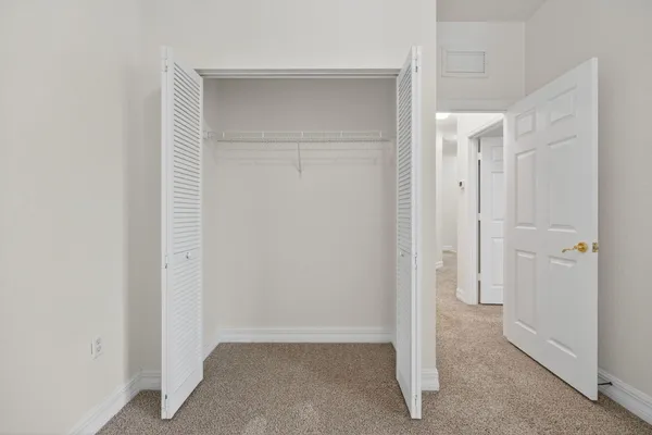 a view of a kitchen with a sink and a chandelier fan