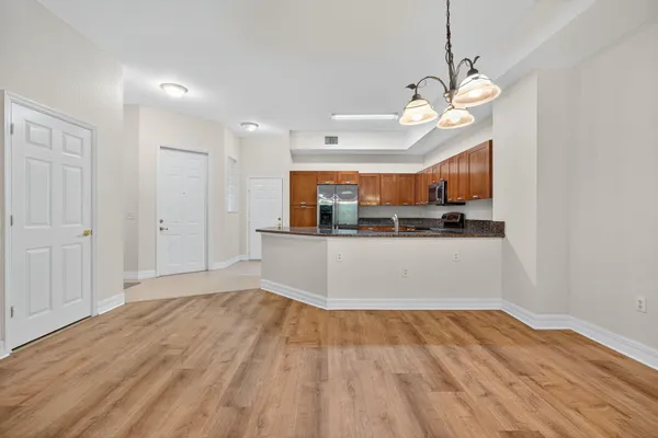a view of a kitchen with marble kitchen and stainless steel appliances