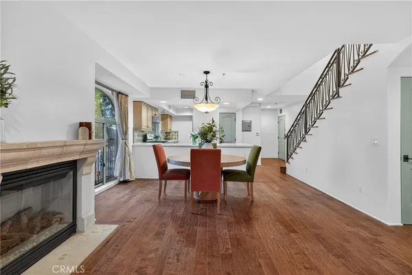 an empty room with wooden floor and a window