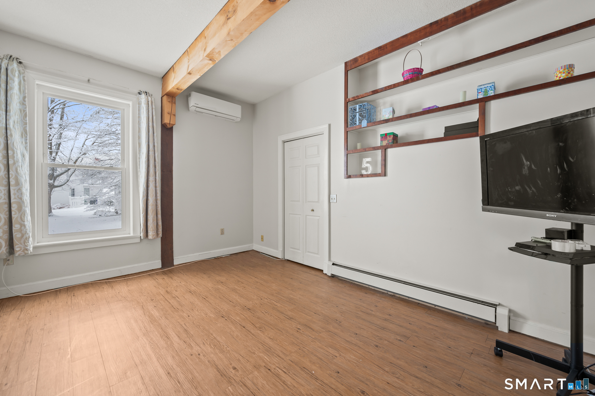 278 Thompsonville Road Suffield, CT 06078 - Photo 13 of 38 a view of an empty room with wooden floor and a window