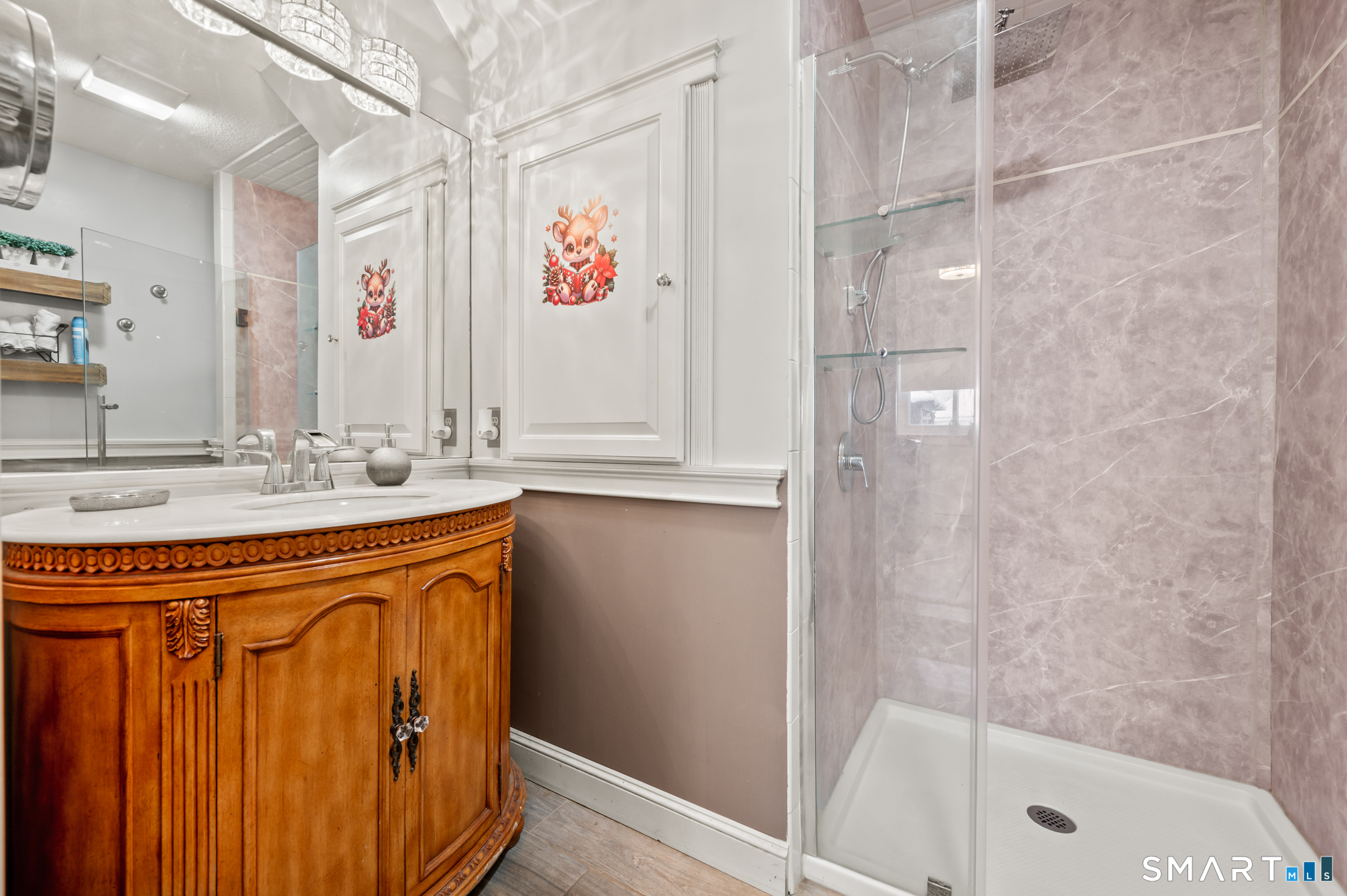 278 Thompsonville Road Suffield, CT 06078 - Photo 16 of 38 a bathroom with a sink a mirror and a shower