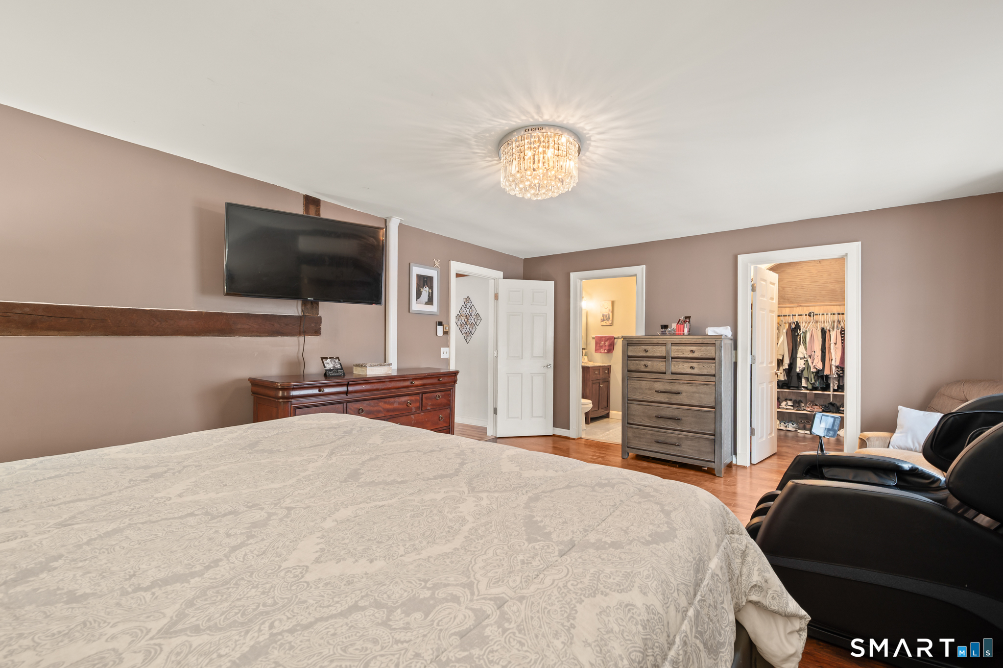 278 Thompsonville Road Suffield, CT 06078 - Photo 20 of 38 a bedroom with a bed and a flat screen tv