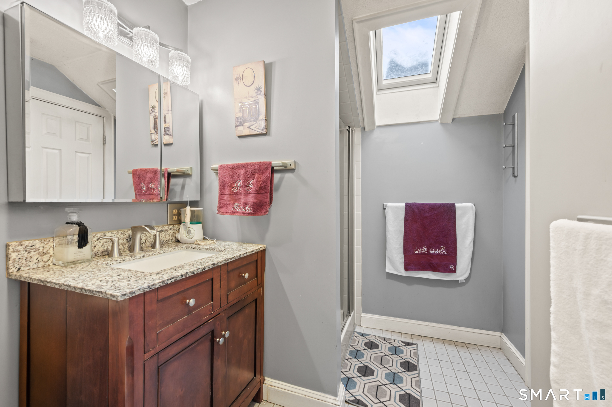 278 Thompsonville Road Suffield, CT 06078 - Photo 22 of 38 a bathroom with a granite countertop sink and a mirror