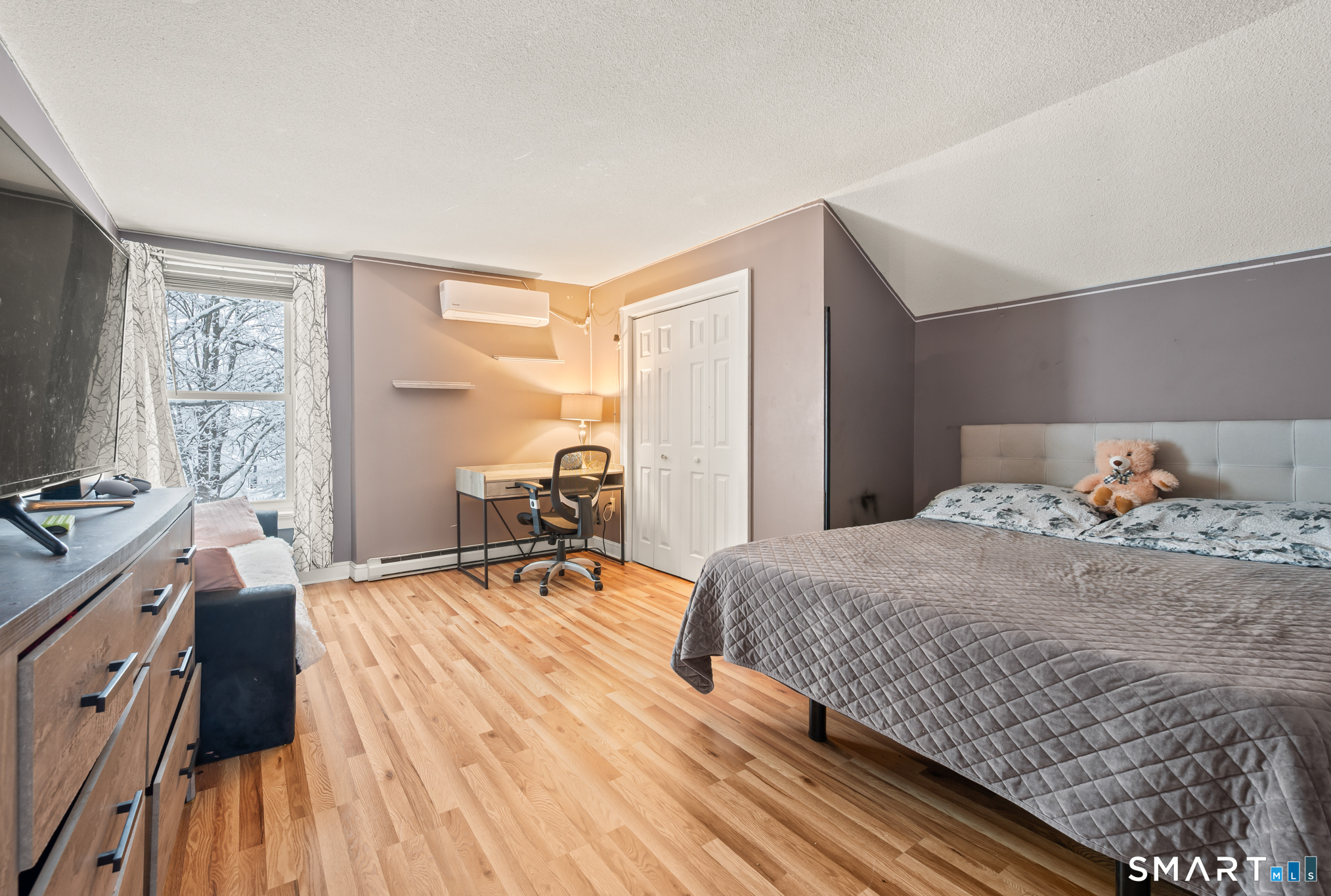 278 Thompsonville Road Suffield, CT 06078 - Photo 24 of 38 a bedroom with a bed and a table in it