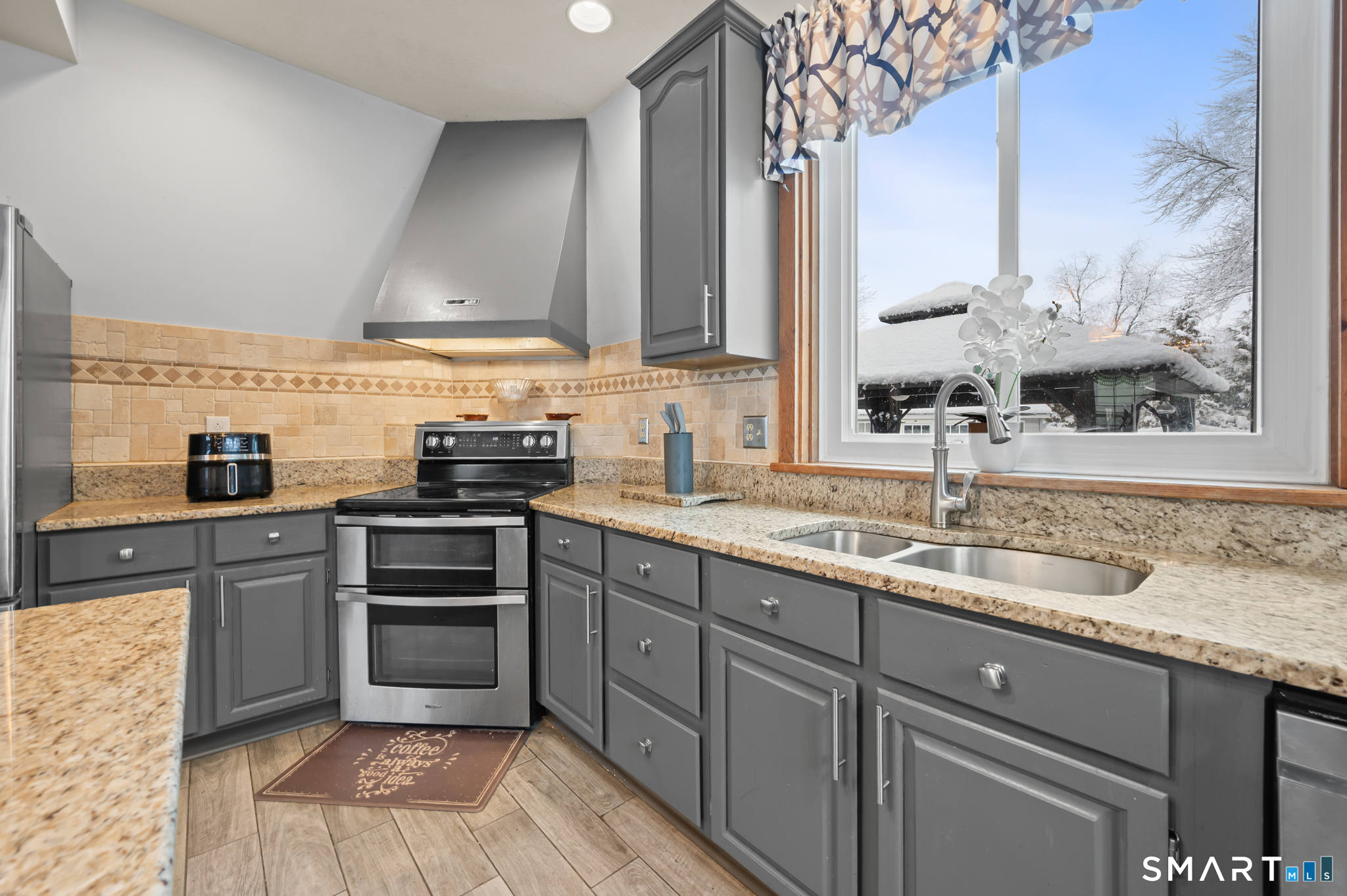 278 Thompsonville Road Suffield, CT 06078 - Photo 5 of 38 a kitchen with stainless steel appliances granite countertop a sink stove and refrigerator