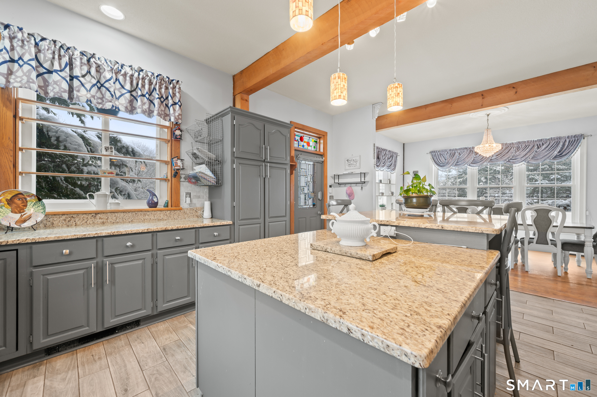 278 Thompsonville Road Suffield, CT 06078 - Photo 7 of 38 a kitchen with granite countertop sink and wooden floor