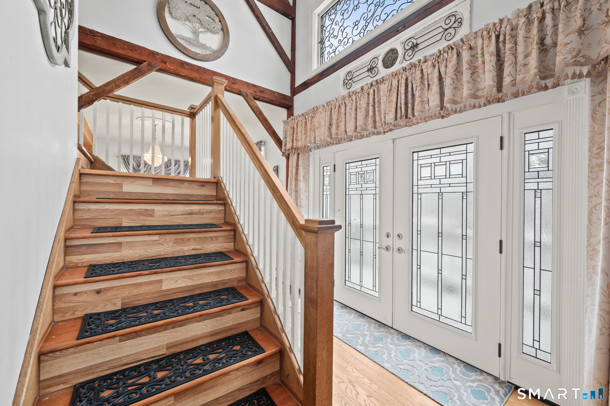 278 Thompsonville Road Suffield, CT 06078 - Photo 10 of 38 a view of staircase with a large window and a chandelier