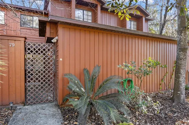 a view of a house with a flower garden