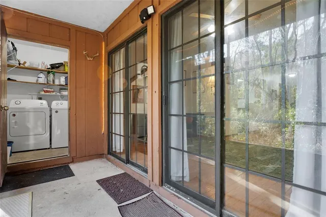a bathroom with a glass shower door