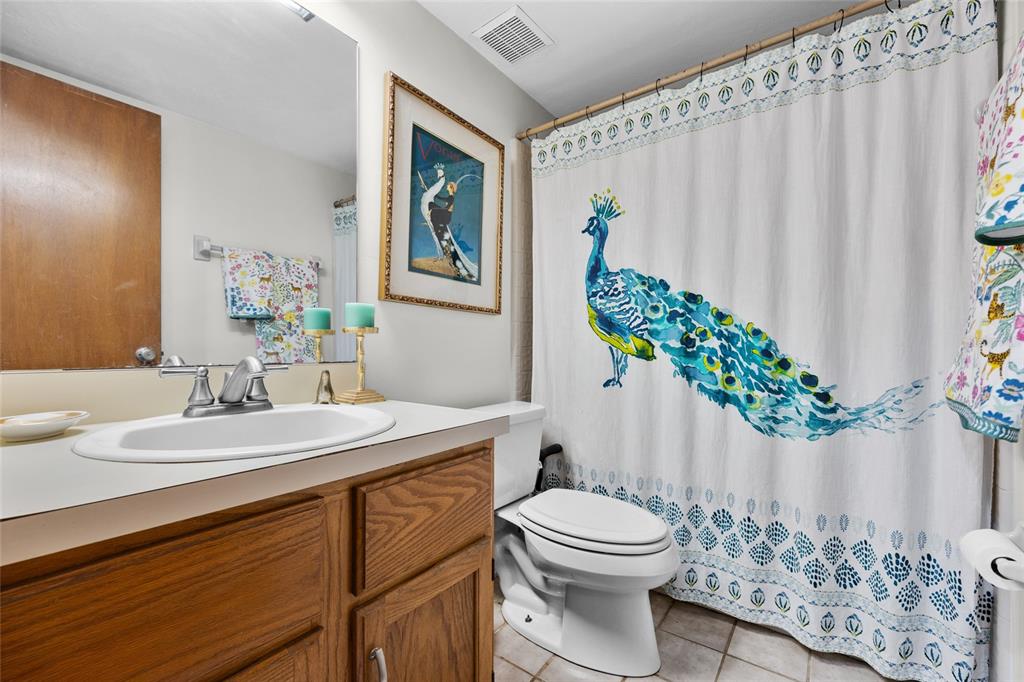 900 Southwest 62nd Boulevard, Unit L79 Gainesville, FL 32607 - Photo 6 of 24 a bathroom with a sink a toilet and a mirror