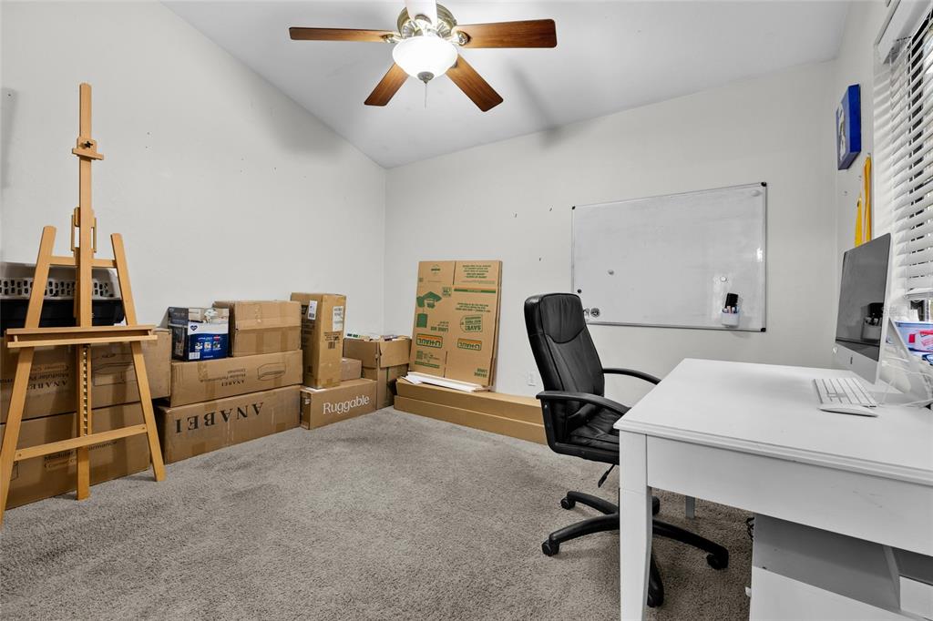 900 Southwest 62nd Boulevard, Unit L79 Gainesville, FL 32607 - Photo 7 of 24 a view of a workspace with furniture and a window