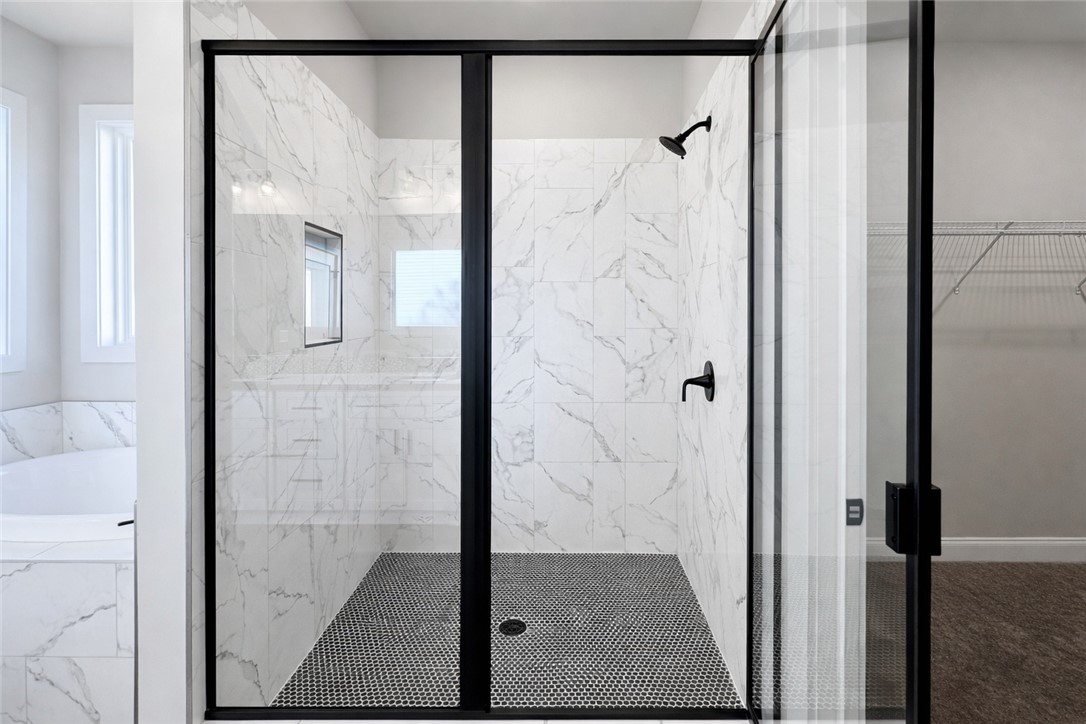 106 Player Lane Westminster, SC 29693 - Photo 14 of 24 This spacious shower features sleek tile work and a modern design, offering a refreshing bathing experience.