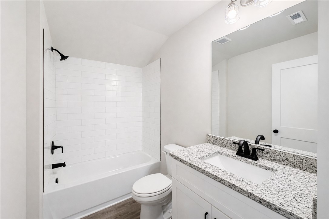 106 Player Lane Westminster, SC 29693 - Photo 20 of 24 This bathroom features a sleek vanity with ample storage and a contemporary shower and tub combination.