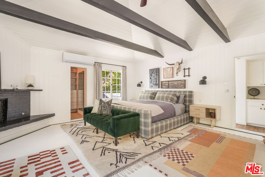 2015 Nichols Canyon Road Los Angeles, CA 90046 - Photo 13 of 27 a bedroom with a bed wooden floor and window