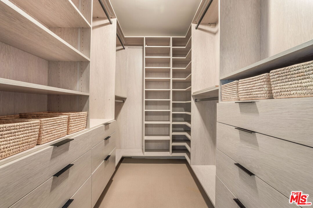 2015 Nichols Canyon Road Los Angeles, CA 90046 - Photo 14 of 27 a view of walk in closet with empty racks