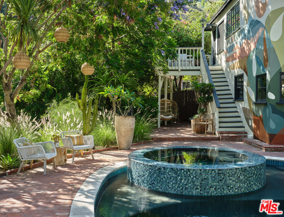 2015 Nichols Canyon Road Los Angeles, CA 90046 - Photo 25 of 27 a backyard of a house with yard and outdoor seating