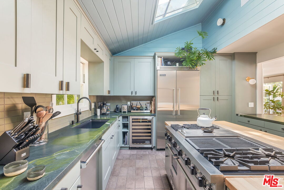 2015 Nichols Canyon Road Los Angeles, CA 90046 - Photo 6 of 27 a kitchen with a sink stove and cabinets