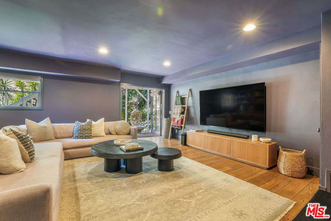2015 Nichols Canyon Road Los Angeles, CA 90046 - Photo 9 of 27 a living room with furniture and a flat screen tv