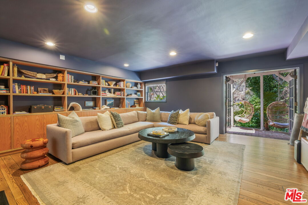 2015 Nichols Canyon Road Los Angeles, CA 90046 - Photo 10 of 27 a living room with furniture and a flat screen tv