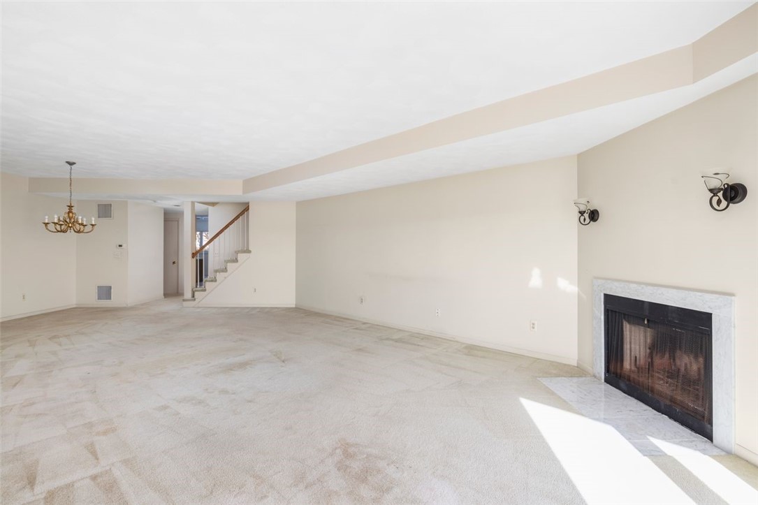 4496 Post Road, Unit 3 Warwick, RI 02818 - Photo 8 of 44 Living room with wood burning fireplace.