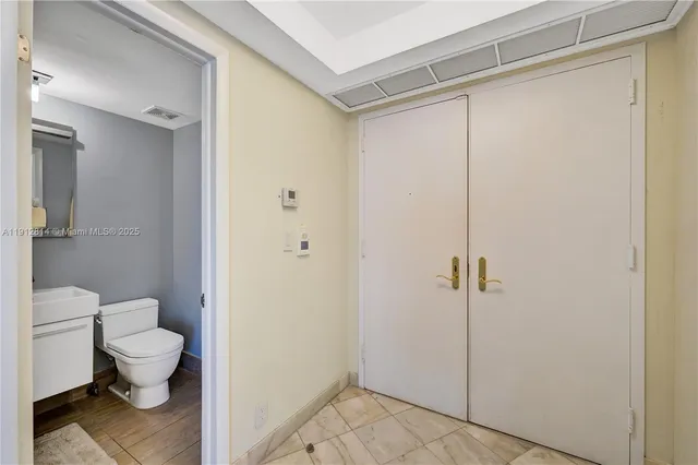 a kitchen with stainless steel appliances granite countertop a stove a microwave and a refrigerator