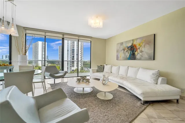 a bedroom with a bed and glass wall mirror