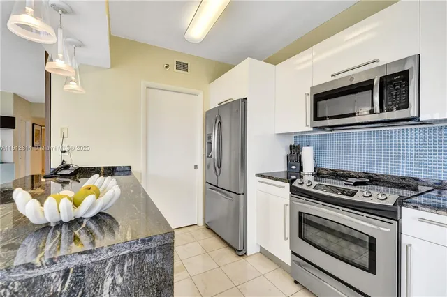 a spacious bathroom with a double vanity sink and a mirror
