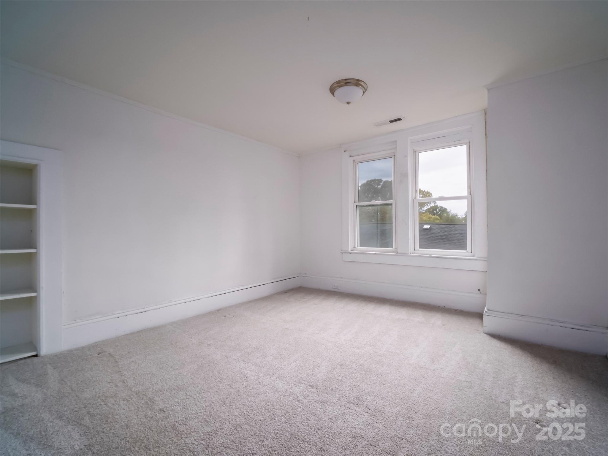 525 West 2nd Avenue Gastonia, NC 28052 - Photo 18 of 39 an empty room with a window