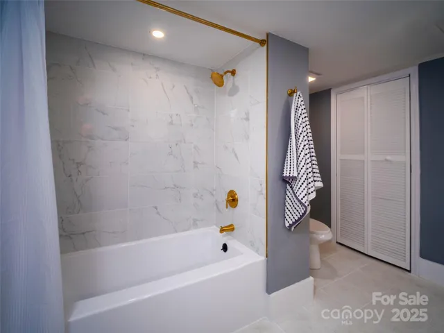 a room with a mirror a double vanity sink and a mirror