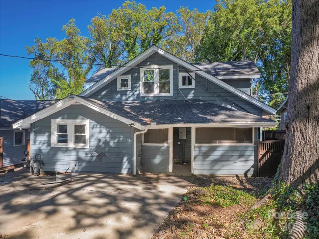 a view of a wooden door and a yard