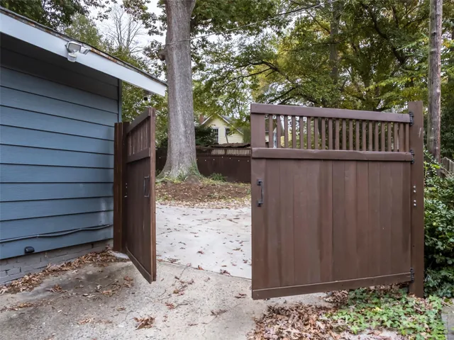 a view of a house with a wooden deck