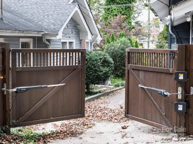 a front view of a house with a yard and seating space