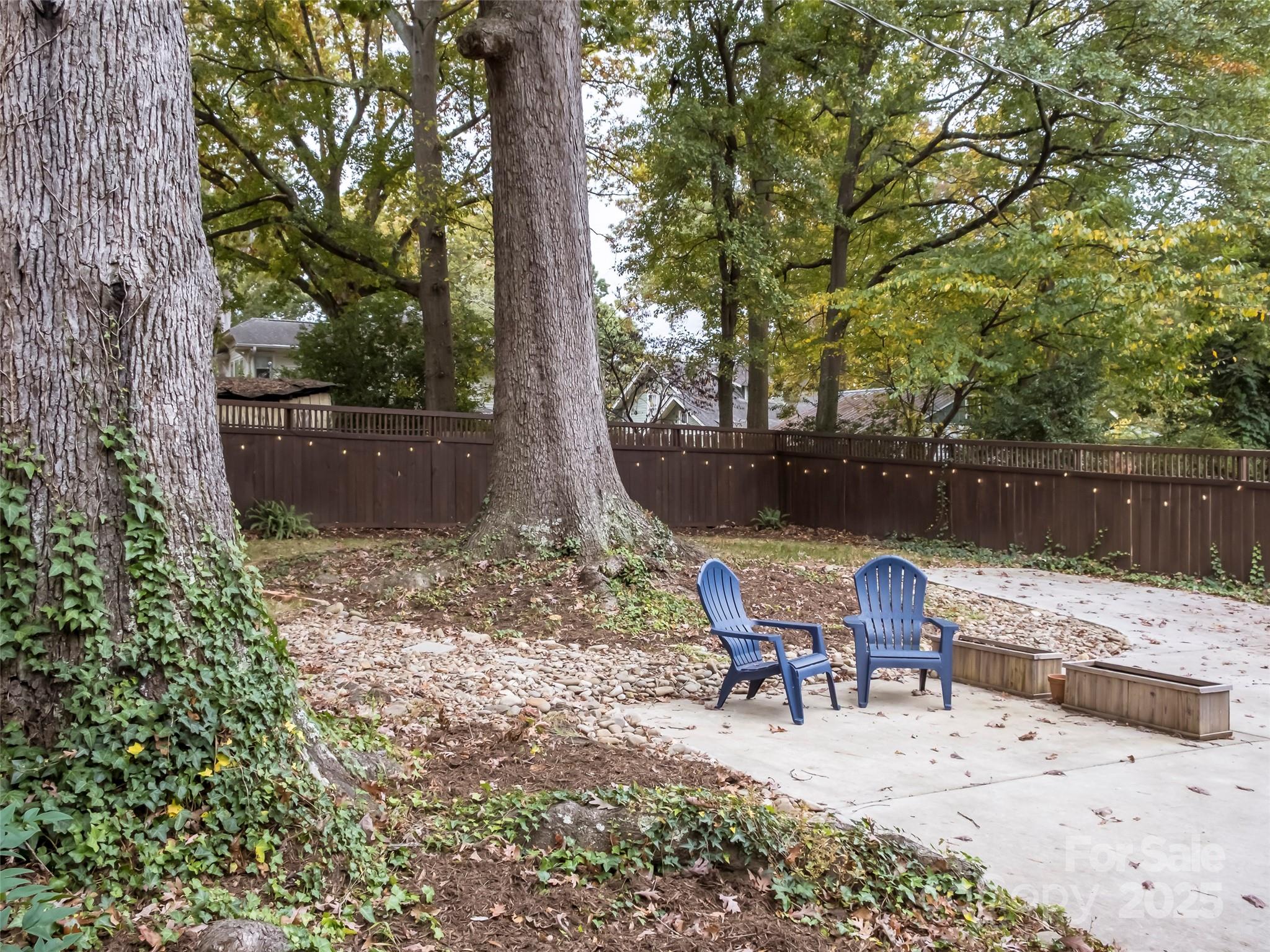 525 West 2nd Avenue Gastonia, NC 28052 - Photo 36 of 39 a view of backyard with seating space and trees