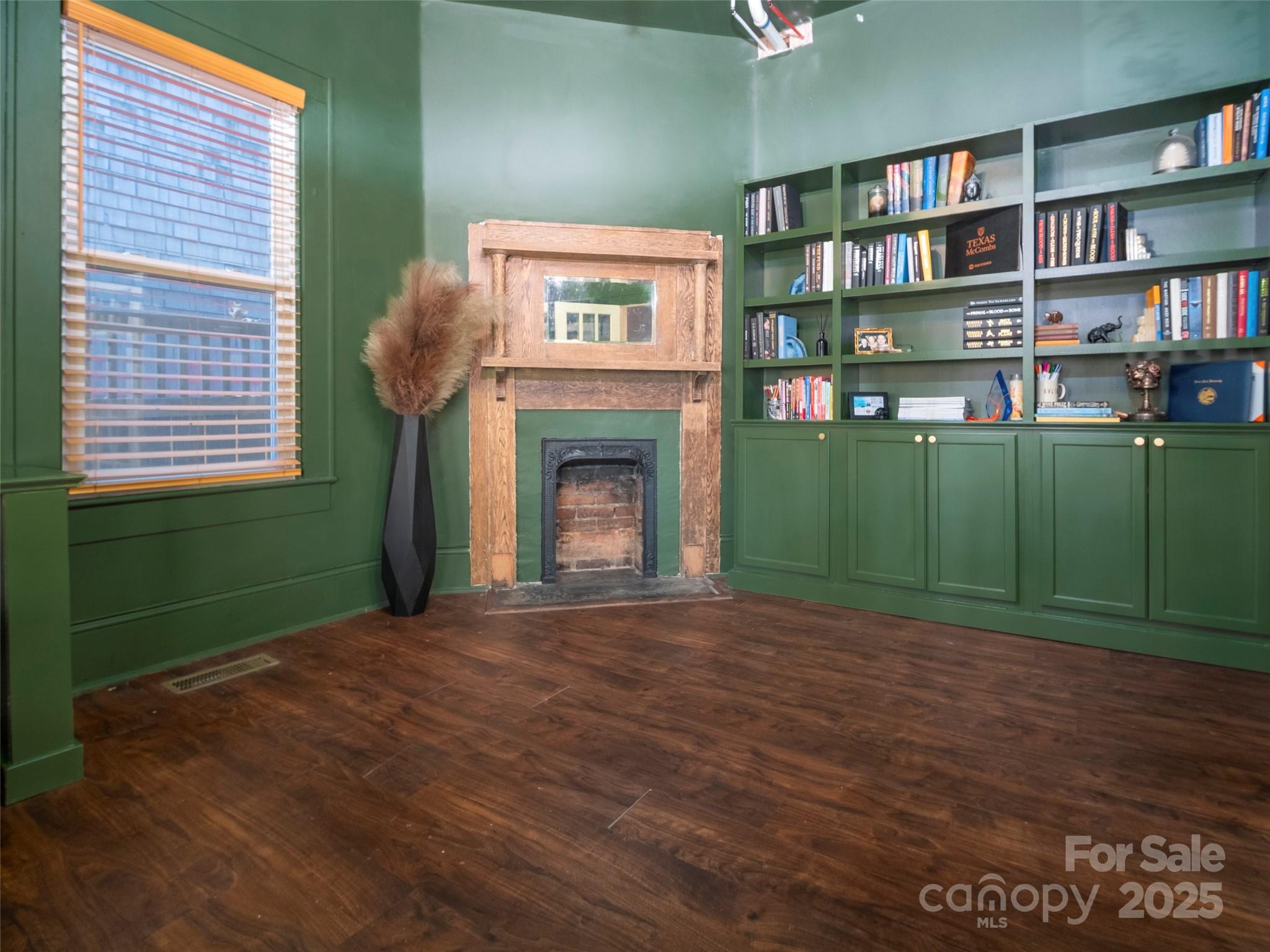 525 West 2nd Avenue Gastonia, NC 28052 - Photo 8 of 39 a view of a livingroom with furniture and a bookshelf