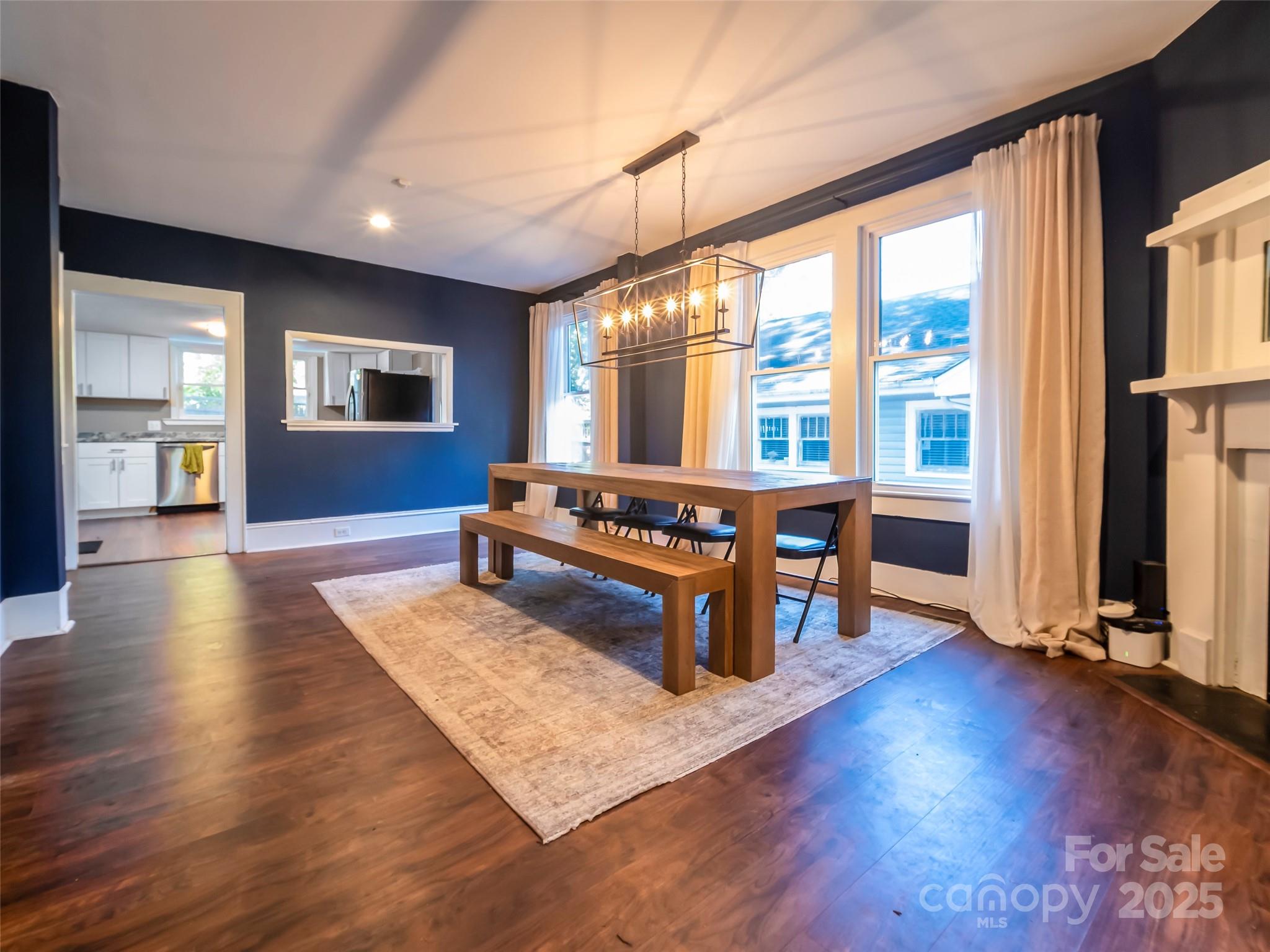525 West 2nd Avenue Gastonia, NC 28052 - Photo 9 of 39 a living room with furniture a large window and wooden floor