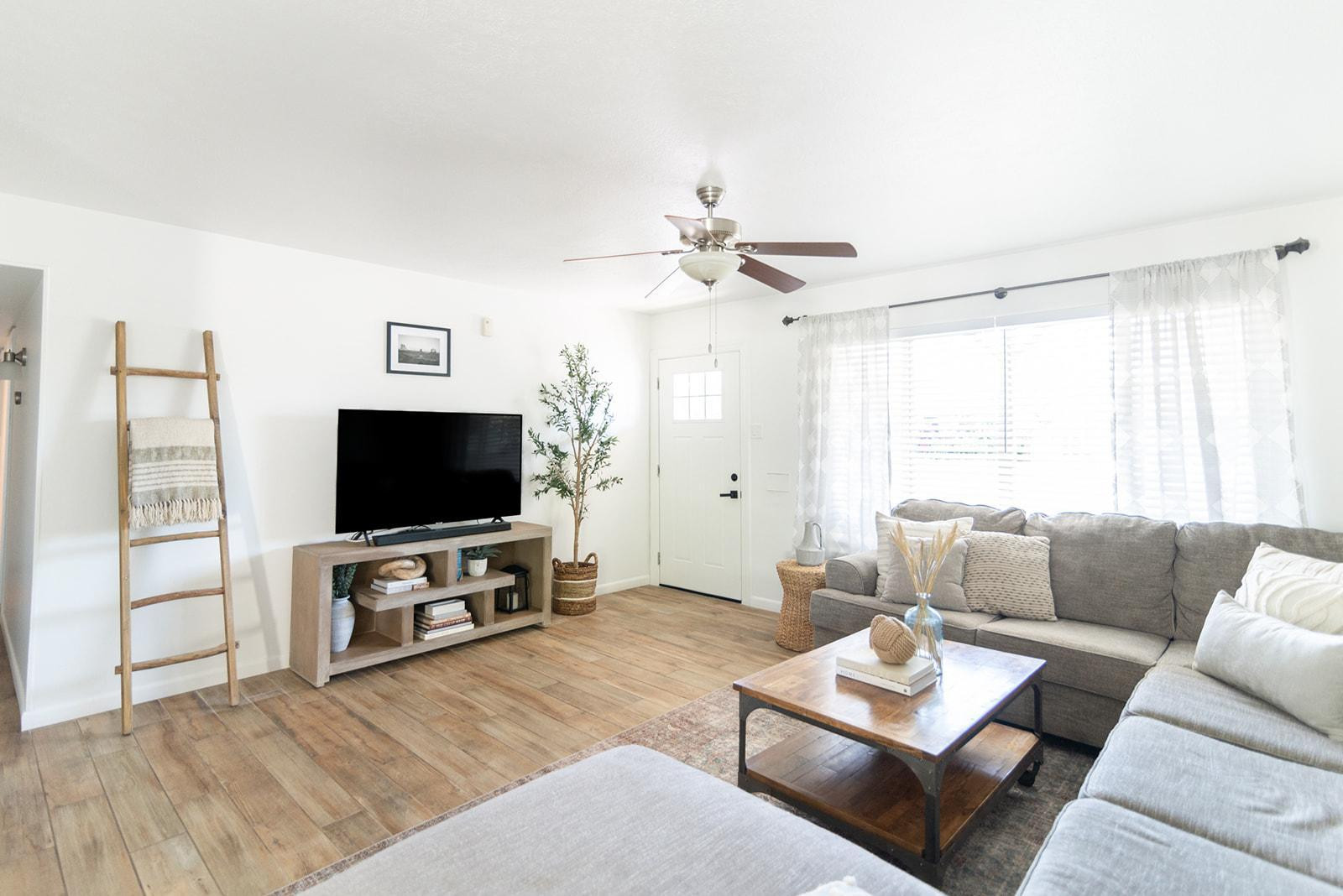 7435 East Granada Road Scottsdale, AZ 85257 - Photo 17 of 28 a living room with furniture and a flat screen tv