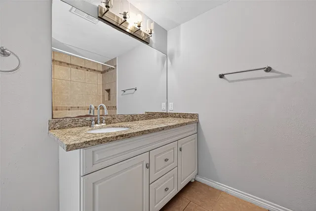 a bathroom with a bathtub and shower