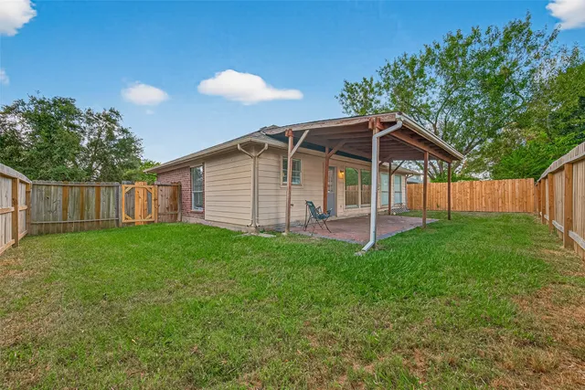 a view of backyard with green space