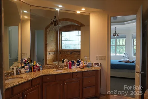 a bathroom with double vanity sinks double vanity and a mirror