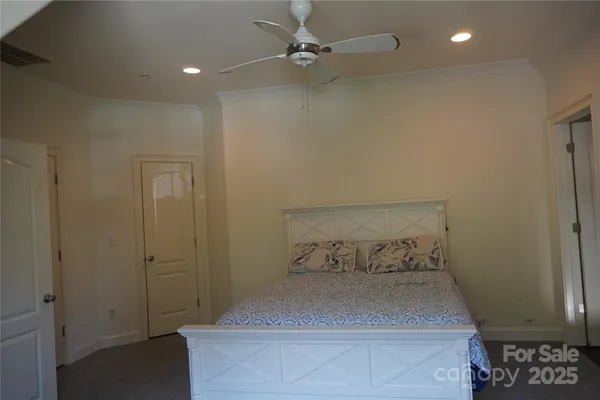 a bedroom with a bed and a table