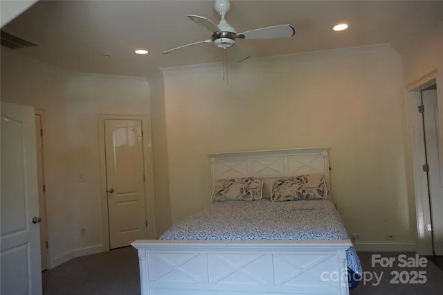 a bedroom with a bed and a table