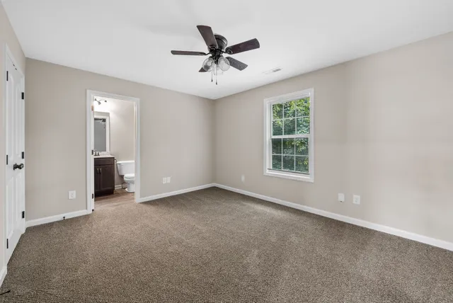 a view of room with ceiling fan