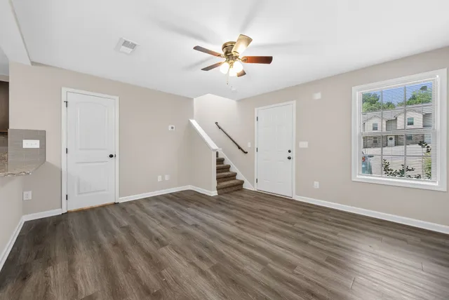 wooden floor in an empty room with a window