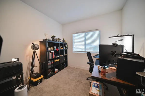 a room with gym equipment and a flat screen tv