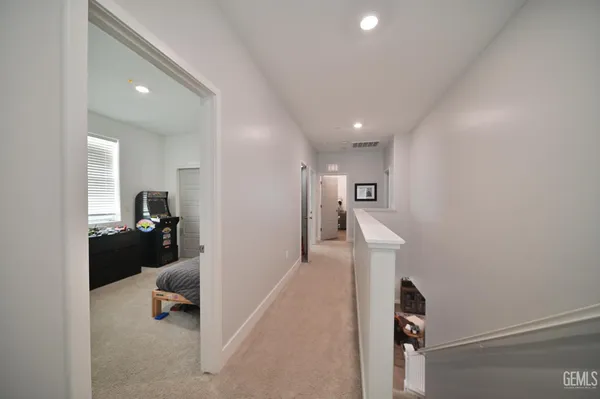 a living room with furniture and a lamp