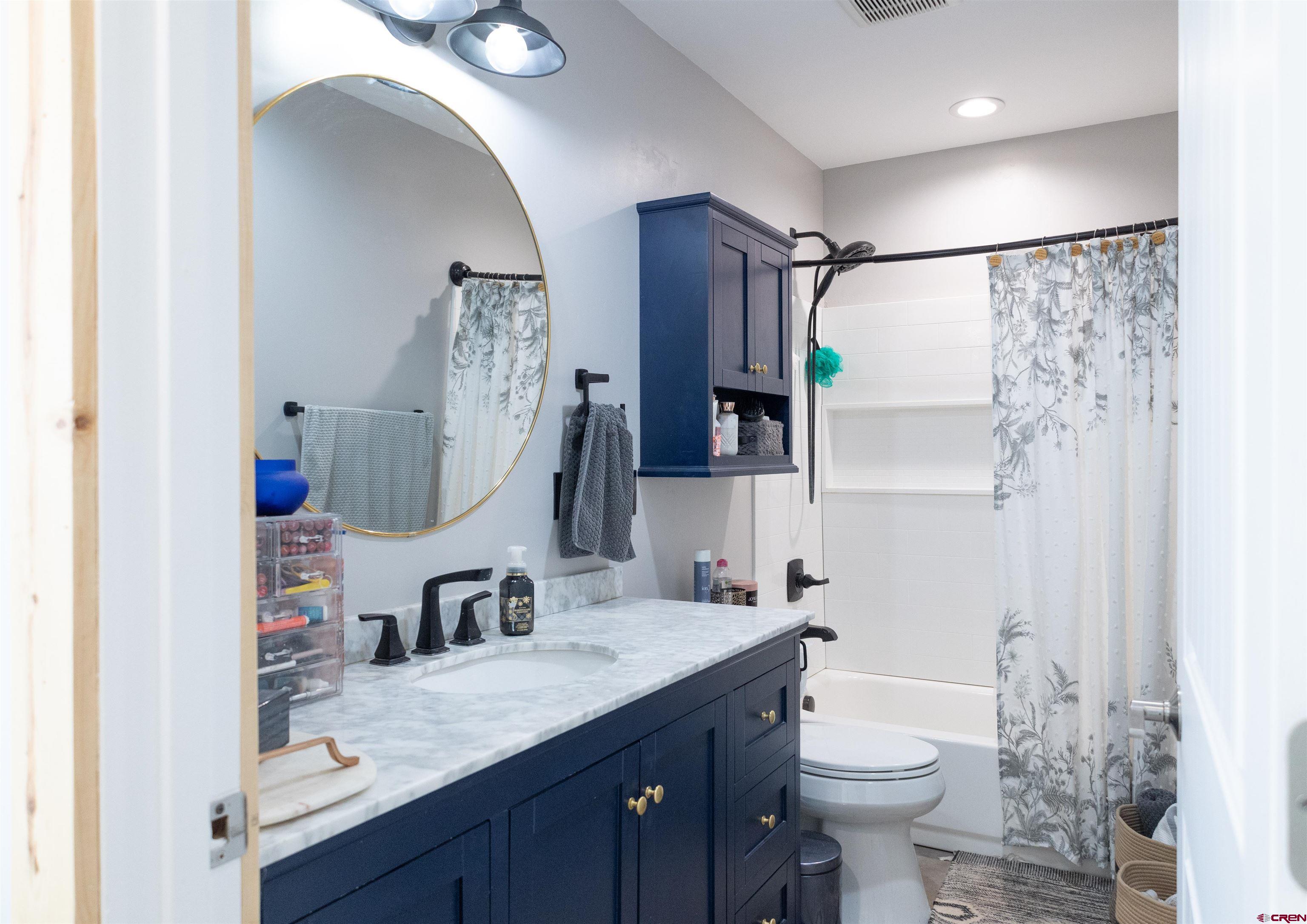 2632 Taylor Ranch Road Durango, CO 81301 - Photo 11 of 35 a bathroom with a sink vanity granite and toilet