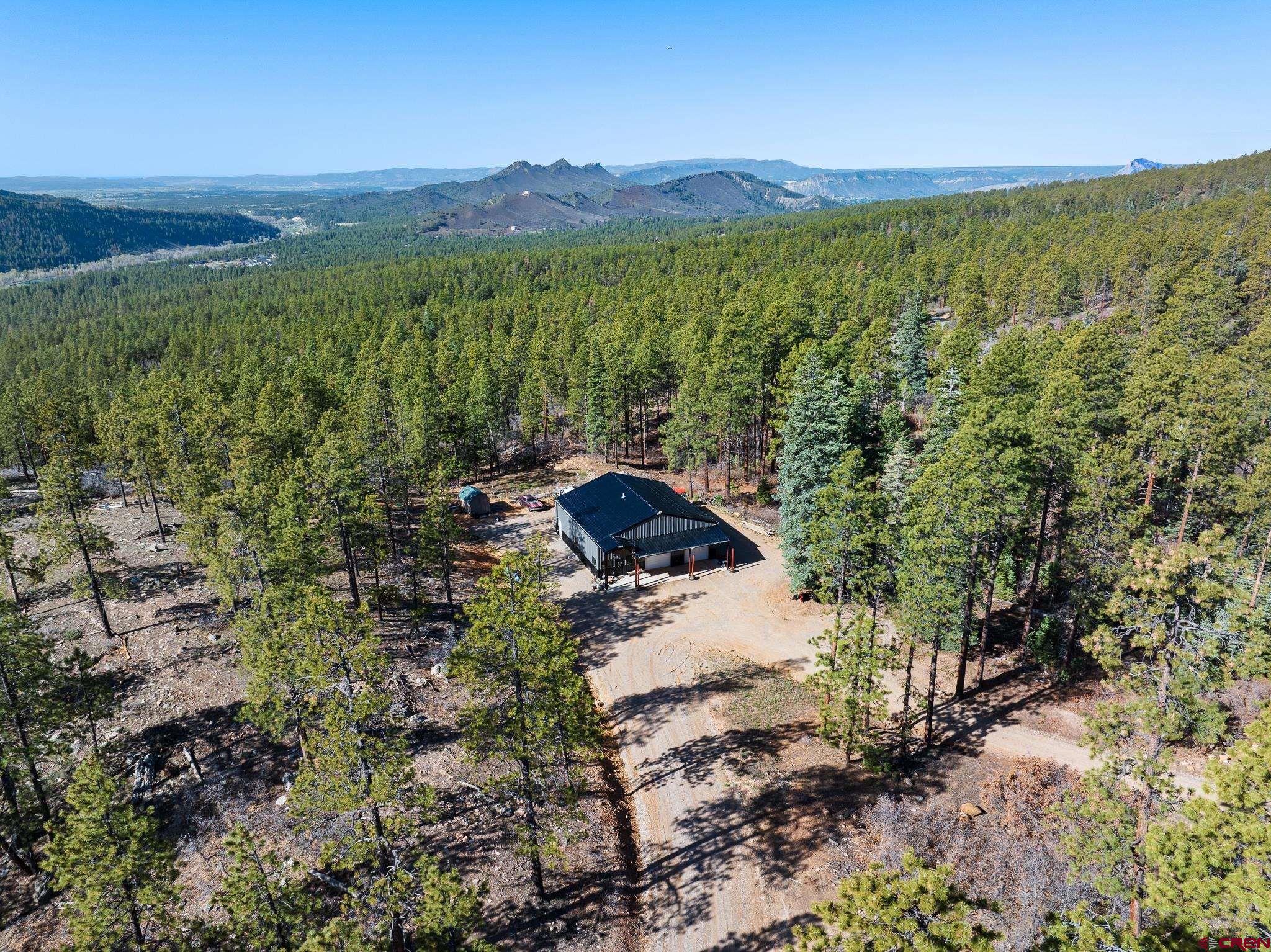 2632 Taylor Ranch Road Durango, CO 81301 - Photo 25 of 35 a view of a lake with a mountain in the background