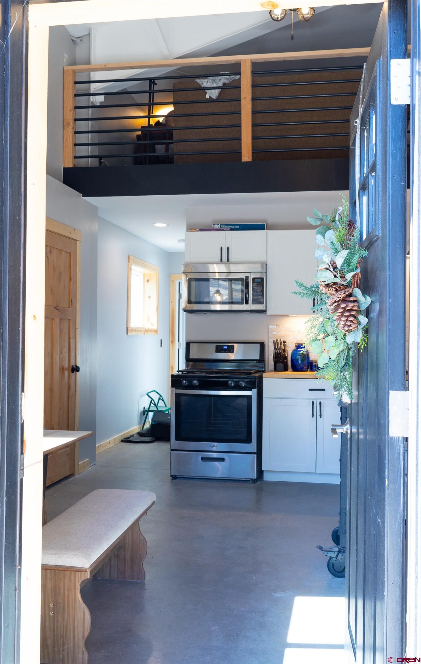 2632 Taylor Ranch Road Durango, CO 81301 - Photo 7 of 35 a kitchen with stainless steel appliances a stove and a refrigerator