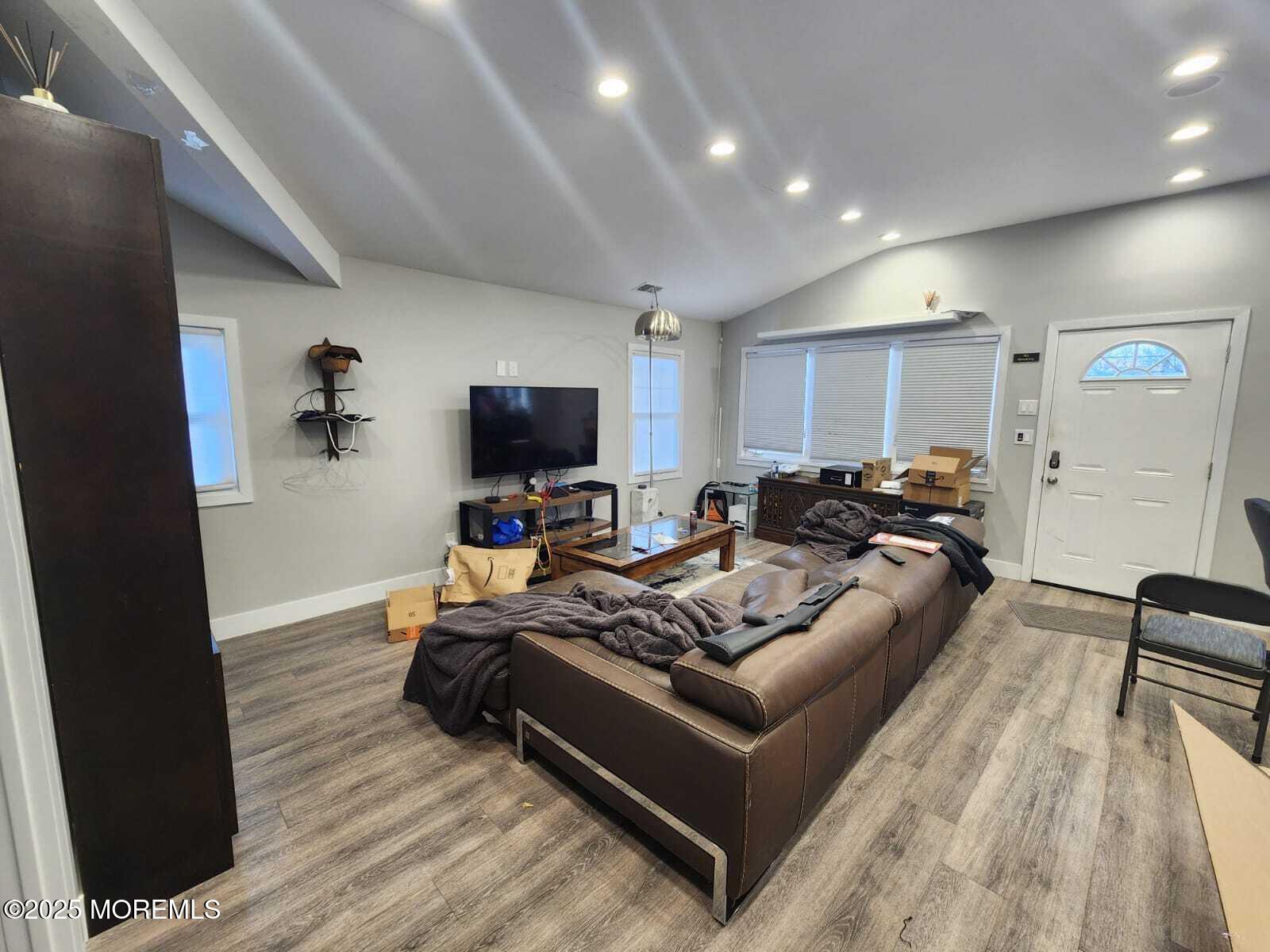 215 Miller Road Lakewood, NJ 08701 - Photo 4 of 12 a living room with furniture and a flat screen tv
