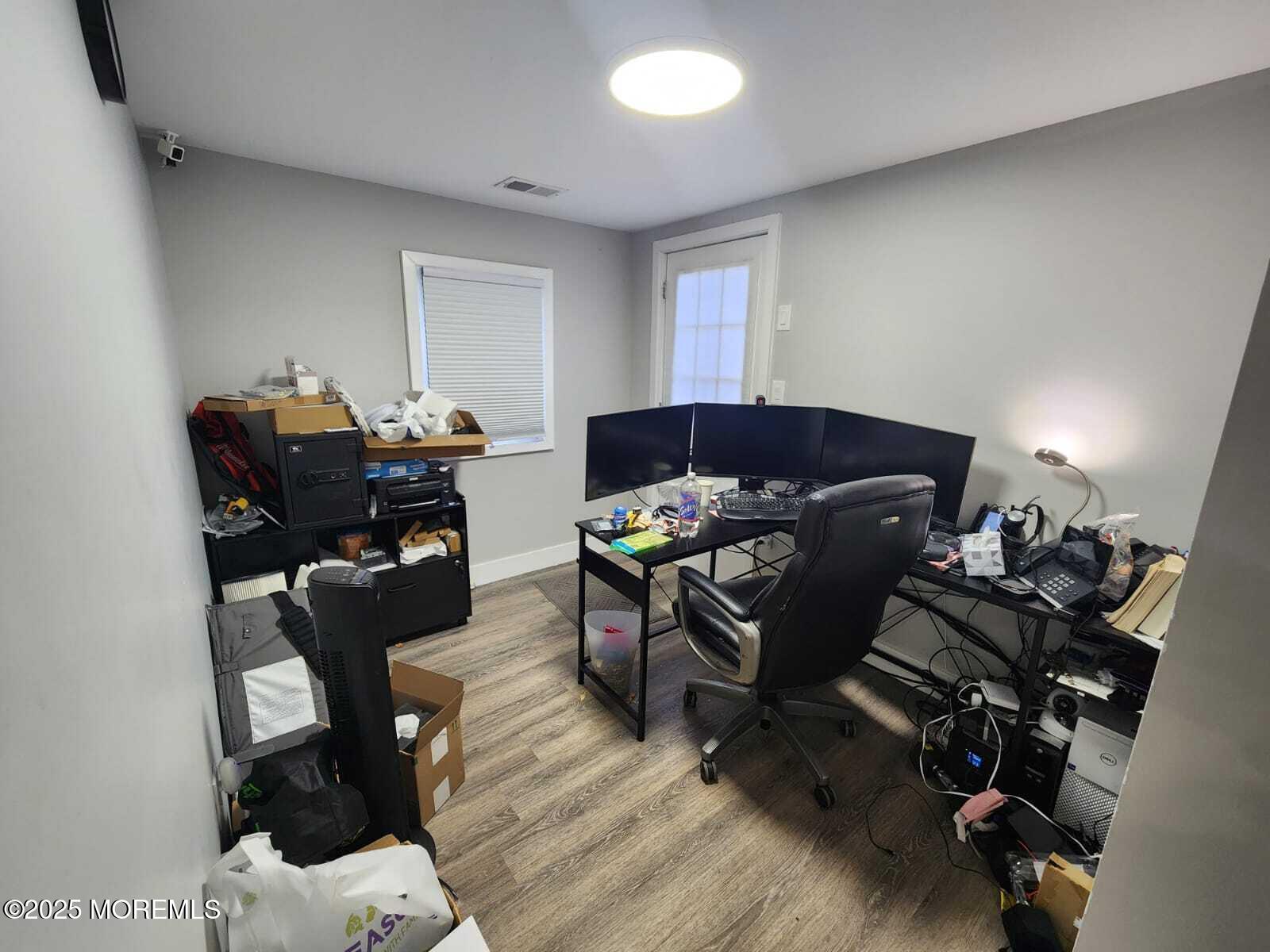 215 Miller Road Lakewood, NJ 08701 - Photo 5 of 12 a view of a workspace with furniture and a chair